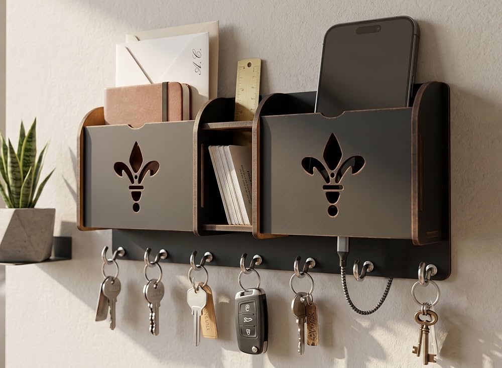 ## 14. Hidden Cabinet Key Holder ![Image](https://images.openai.com/static-rsc-4/NLT_RZacsqLPMdJuFUtLavVgDxqk3vz1iAgrKAPliFy_ikTDO6Pt6MB088yz60Jb8rcvdgQgZ0ZiD7-OpL_TjIzdWiimnjriZMvftOJiD-ub-Y6ri75_EtIwL3_MO--Kc0Z4rsMWS-Kwbs-HwHLxiEiTUdyGmVWT2OkmJrSqls462FJVFz1qigJWpIjr4LVv?purpose=fullsize) ![Image](https://images.openai.com/static-rsc-4/Pqh92ndrgaAsMM8VbYrUj1PME4RPFdnyANxMeQ560WbAFXvUIJd-c2CKyf7VuDEjGUiENrtc_mL0SvOvetqLjXtLKvghm0ziX5IBxyPXPRDPRt7Feszl5QAQ3bfxpLTaac6gzS6IcsQvTHE76e5SCH90m6tFqfNQAZJun0cvE8xFqkD0MTEWIzWmPGlVDuJF?purpose=fullsize) ![Image](https://images.openai.com/static-rsc-4/GWbX5Dj2mQNvuEfnTawKNCYLnBySKgPmWfC7qvKH-g9y5EHZN-1MoWrlVdNuEKm8Rc0PmT3qEgJuXUsZjEP5VZsQ_tUygMs8dBLvgURsqBH3Y8_GgOy66P7z5IfyYG6b3LzWLo0819k09PcrPzlLQAi9G6MaWbUI3VvnT_DUsxg-xNCK--IDUVkof85CCXxl?purpose=fullsize) ![Image](https://images.openai.com/static-rsc-4/WFsoGOf5FM9xf4_MWRaIu6-W_1abHiP8VQLWNgly_5jxvISQQUF7k03zFABH1w5-8NCNdAEdhKndZ3mivJiAdahvMgJ3FDJZ_3aqgJUW3qcVpIirwS-O2F1pPY6RGxzW15FSTocfNmFkyXS4m_rbhhMV8d2P0tJNIw6MveYSDclqtICTjMJJ5hccZ3KBDR1M?purpose=fullsize) ![Image](https://images.openai.com/static-rsc-4/wzCePx0NI4N7YSKaAM3ansDFsHXDqXDaHse4SaRkVrqSUS9tLyaTbudMixT_a1PLUMSkuJjcJsfJIGFhqistPBulK_zuMuGzIEI7xY6RcbdhVOUfSqw0Ol2P-GDilmh5pJrvvQjLH62NMsTJ3BVGBY6vtT6Q7zQK_dNRZEW-EhCz1Tvpbd_c0ZZQ-lb2i7pE?purpose=fullsize) A hidden cabinet keeps keys neatly tucked away while maintaining a clean, uncluttered wall. Inside, multiple hooks provide dedicated spaces for every family member's keys. A slim cabinet with a natural wood finish blends effortlessly into modern and farmhouse interiors. The closed-door design also protects keys from dust and keeps the entryway looking organized. This smart solution combines privacy with everyday convenience. ## 15. Mini Entryway Command Center ![Image](https://images.openai.com/static-rsc-4/6vW4ASDcWfulVX3boWXn0a9lM1bbrB7PIY1G_5X1ucDlBw07RcnDenDn1ISP3ILIhpVbPc0H63JhOA99VD7hQg6KQUrg1_hcSOK_Ms7vKfRXxkm4n67W4R5KINHO6NiFCibTJ5TG9Pypqy_2rWq_mq10t8nSZVL0xrWbA7TS9iRZLQnckTPARQstf0iuTWsZ?purpose=fullsize) ![Image](https://images.openai.com/static-rsc-4/7PMa9fksRYk1czqO33pF_wovT8hYm7aXBfxtVKMJp0YqaEueOXGlg3pr5EwJaaaL0TXFA6Ig04AhTr97LfQD23rz2Hc00Cw1gyJnQQNlUddQOtJ67Yx8JUDtmsduoBqIZDIG77_HYmfr7DqTacomNqTUjLzXNy78YjRyyhgrZvOkE8RLLloBE-_8MdMpBJwy?purpose=fullsize) ![Image](https://images.openai.com/static-rsc-4/xOpgnZQVtAIff6bo6X499-Fx80Ktmn5joMFbAfIMtMJInacmQBK0oJ9TQWi5jnXVghz6ZuAW1z8v-zGmY-oqHnQPEjIyDMWGOIdVxw7q9NZRFvK96VDwYBwxxxjxhzPAHpZhIkgBfvIqucJg3fkGSEqZNhDMI-9de_dctcvqqE9DaarVbFUCzFYQQVzZC7zk?purpose=fullsize) ![Image](https://images.openai.com/static-rsc-4/aE9H3jVGtRJ_YXNA8naAoH1C_0mHdH2UUnuL5eVyvgEyB9btbItU598bFNEot1PhHR-RTp6PaSFOADYQ_L9t6Bxx0fXoweiI-DKaHLkWnHOR_-u4yhvK7y-Mktw2ww77DjCqhZNv1b2_nXXzNKB5rSwOoHU3zdxc1tvPg3O2wrn6tI6pw-l8SlxY2_04Le8a?purpose=fullsize) ![Image](https://images.openai.com/static-rsc-4/pqUpoLEErPO39HOfo1Zxp4eVxd1VHV7occpoOfAUn4zkF7GtdJ8NKrawHFIMdfXJRkXnKMouxMxXgBYkiU2NBqixXAxTp9vFcu2h_xCDUJgdND3ZfCKVEbpf8Xs2bZAm8cuCR9Iv3wV5_160i_lgaWv9NTLbdDNM7l15WWiycKRtYIGd4OpGqCd6VdIoGBCr?purpose=fullsize) A compact command center keeps keys, notes, calendars, and reminders together in one convenient location. Hooks below provide easy access to keys, while the upper section organizes important papers and schedules. A simple wood-and-white design complements almost any décor style. Everything stays within reach, making busy mornings far less stressful. This organizer is ideal for active households. ## 16. Live-Edge Wood Key Rack ![Image](https://images.openai.com/static-rsc-4/1Oo42ZZs8Mtk0VgIXyj8Tssuxc0vsziqbQUj1N0zSN3omg_MQVRGIFc2xA91kvtqdPI-81zPTbzVkaWV_YDdv3L0LR1OnOzeLAITgY-r8jdzsAENV64No5jpZV_x5GoxD3pOwwQFVAagxK9WmZN5XYM01JYtTktWf74O5fN6N43TJYKmPEDtaQ7q5qCY9BLW?purpose=fullsize) ![Image](https://images.openai.com/static-rsc-4/eKoUCe8IV8PKGOq7a1BR3njU-_dg74OMEhBTM-iEVSNhIXs0RzdqAFYCiK23-gDAujoEcfU3kRDdBuTq-IgI01SY4MPB4LvCbFtnP8wlswGBV-KXrK6X3ABS8vmVZhTW7AZW81JCmX4fmOxx8OaoWWThKjrR6-sazmBXpPSvg6EOXqP2T1z7snXim2FSN6r5?purpose=fullsize) ![Image](https://images.openai.com/static-rsc-4/LLbhjchAWwP-ahUvaH4rCrGNqKVA63dMO6_vQWOyHq-DWYjzA8Us_5xdC9nkr5qzxKmwzGPA_hp2KD0uf8cJN3Shs1IPsTCAzQDuqULMPOPtQ7Wu30r3jxmr5ZtA3qhzOgbaqaPBReX-YFuPTrVVTR676jglEduZwgai9z0vExqWz6Tp71uKe90SEumKP0K8?purpose=fullsize) ![Image](https://images.openai.com/static-rsc-4/VkITbO3nqnjMnYWSjv82K6AP8M8Whsneuf5ytl0nvn35uBX4c7IhoX78GNYvy9N5f2lcvm9XhB2LaJmG83WFJQ_XBkKifZexcp8Etq7rt5iCrqtAdfNJked78b7DSJkoTLbYpvBhLwdc7NKKeD6uUI5oqqw2hNKe7_5MRe4Tgq1s0IUQvyEGqQssUvxrarxs?purpose=fullsize) ![Image](https://images.openai.com/static-rsc-4/JBsgj2wdrzXOAn-RrbvsEnCEr6FsasruxYT2B8sN2CfPr1RelojYwkgTlPOb3Fx5An6wLkiZFHuZ9CNrSRFKJE0jhqKm4HkhNSOl06kExLPUP9X7dZhmlDB3863gukCgFLdmEYSpul0p2YsFBfQDNXlxo8L-oHk-tS5CO-sh0E4qdUhEFGUcK5zVkSD0VgOZ?purpose=fullsize) A live-edge wood key rack showcases the natural beauty of real timber, making every piece one of a kind. The organic edges bring warmth and texture to the entryway while sturdy metal hooks hold everyday essentials securely. Pair it with greenery or woven baskets for a balanced look. The handcrafted appearance creates an inviting atmosphere from the moment guests arrive. This unique organizer doubles as wall art. ## 17. Acrylic Modern Key Holder ![Image](https://images.openai.com/static-rsc-4/FdKpal_ZARxPizdFsISa7OTm9e7ItXcd_xB67ohhKf5oaU1zqqd0ynEybytr3LJxaBjzvBt_xXA6IFbdjZ3xKLAPHUBs2M9A298WJ4R3O3VPbnpaOX2N-i9kCw-egJoSCfWQIpUlNVmxcBLSMGgbisySnDmD2seETr_HVjcyOHfEnVUpo4Y6G2wXtitQWKYG?purpose=fullsize) ![Image](https://images.openai.com/static-rsc-4/dEsOxmq2eOhBMWdxYEO6OxeJ8pA8b2Mf7vwvYy2BKfNjiQ5_M-h2pZmKbBjD2IUIFYoT8fueiC7qpmMM2fRaiqCA-eYVYlHlD3GqwQC5rundYf1VnAtt5YlVPW4BNdUbpWOjTjNCwXqAxEEyh5g9KW8lFERHDKG7BkyOgbzyfIauL4BHwcScSwRTimuXS9w5?purpose=fullsize) ![Image](https://images.openai.com/static-rsc-4/X9fW5ldxp1LfStHckGuQYB_TZ75HFCmlLfzUPYptWyfl4aCqWE05adtZqVp-hUpEiePSXtHObB4szMhZw6rJmf5_AUj4ZK6Fn-aRNOyQITp-uCIX3Nu0u7OGcyAdktIVzjsPAgKM5VZpeRltIRtkJpt-iDeEgRUUSymgfNhtDRlMkCuURMPxyTllUvbYmngd?purpose=fullsize) ![Image](https://images.openai.com/static-rsc-4/6CPloHgvmxRUYdB7WkOASN0Vj7mWfMec8uuaFUrS4SibN6iSIeYI_-75925oi7RIZEOjc0Yy_UKgqRCx-_AqFdP6kgoK50PrxOzvo8CE_iQNYy3TU8UosqM_NV19XVNkxz1Tvzjn-NhmCBEisVUQeBWdro40PbcwmB8_FlNSYXaCenvU7pcJ7GmHgP3robUk?purpose=fullsize) A clear acrylic key holder offers a sleek, almost invisible storage solution that works beautifully in contemporary homes. The transparent design keeps the wall feeling open while providing reliable organization for daily essentials. Simple metal hooks add a refined finishing touch without distracting from the clean aesthetic. Install it near the front door for effortless access. This minimalist organizer fits perfectly into bright, modern entryways. ## 18. Wall Grid Organizer With Key Hooks ![Image](https://images.openai.com/static-rsc-4/P2-5o80Ut90daemZxDwAc_Z8b21sWgIfgk7FD3KLN-HDIe4Nd1cHpGb8uC7s6OQqBNnzko2R650BKi24W8kYHg20bZdjDVP5ymdZSKDS2X-VVCEhsfGPbCO7WqJX-jsESeC33g8K-AQXaT4Ii85kD-XUNhxt_WHVVGkJ1t0BM5FerbO_1i-3DyNZ4jF0HMq5?purpose=fullsize) ![Image](https://images.openai.com/static-rsc-4/1TSLZBmDUQVWuSuHANGFui8QlhemZryA6m5_M63bdXvGji4wVXuZsc8VXVdiO3fmUwrQclk6-tsfsePVs4Kc7R2IdmbOo0hpEbTkHnSTK_cDBxRrC4xPmWo4YetZPZjw7Rr98tZKTCDm6LutOFDwxarXjSdf6RfTXjeTxj6yfn0ZSovBQuhYIocgUDZm_37j?purpose=fullsize) ![Image](https://images.openai.com/static-rsc-4/GT-C2_QdGRwu635JzbB3Zo6j17ojJ49-_5lPQwMRYBZYSebc7B_E2D39Oc2XDAO5QoGnAJQBVrx0s0N6fiFCHO1HZkPBlsVrP1HXKnJEp1B4SQzPTYLSXFoTq6RSgfYjSswfnPubYYU3BSduD4ASL_t_Aw5e56AP3s67OEnxF4UaLw7qhna0B_a-1gQJ1Jnw?purpose=fullsize) ![Image](https://images.openai.com/static-rsc-4/DiapDSZm-l42FOgjD_4a45FucbIHCDunt7tK2kWxZ6oQDadNG5497s9P8q3XKDQhC7kMupW50jBVM5VkI8jmxu7L0DP14AJNYO2-3e42jxe59mdaw-ZPnRpmnt-0GrL0wcyRKXrrxXQbo2Jqu6unWDrlLpYX5dcnrpzEsuemuL_Gh2IwIvn_y706TPuvLTXa?purpose=fullsize) ![Image](https://images.openai.com/static-rsc-4/KKcGe6avQ-puup4hpVvZke7uDVaC0RUTFs4rl0aLjhONkJTnU5HfiKtmnxiAqQGlpn6BNcTCPY_JnpBj5_iLtfd0DaefWL_EeeLByXL_vvrvQcRhCn4U3zNJw5uENLIAnWp6ctAxnzaWu6kjKVKMQQaE3QyNqXkMsmLOd0-6R9kAB8azbzeDyG43OAQ7zLCw?purpose=fullsize) A wall grid organizer combines key storage with a flexible display for photos, reminders, and small decorative accents. Clip important notes or postcards to the grid while using the lower hooks for keys and lightweight accessories. The black metal finish creates a modern industrial look that pairs well with wood furniture. Its versatile design keeps everything organized without taking up valuable floor space. This practical organizer adds both function and personality to your entryway. ## Conclusion Entryway Key Holders Ideas